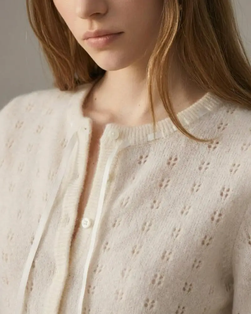 Vellara Knitwear delicate pointelle eyelet pattern with satin ribbon neckline detail
